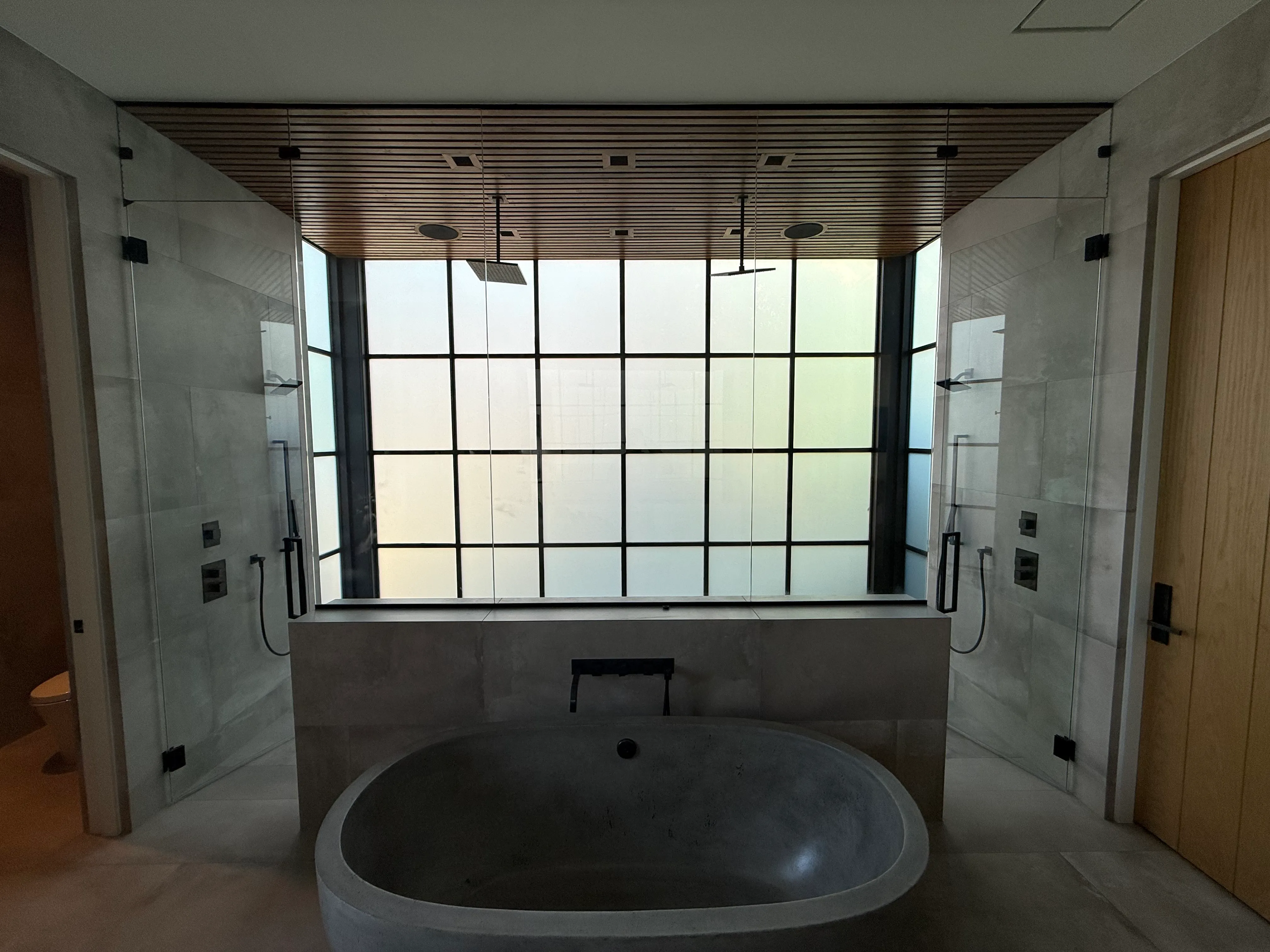 Luxury bathroom with a Revive smart glass window frosted for privacy